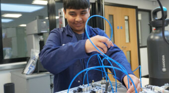 T-Levels student using Hydraulics trainer