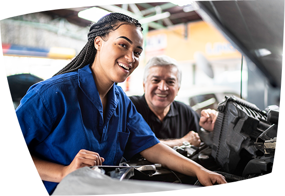female auto technician mechanic with teacher